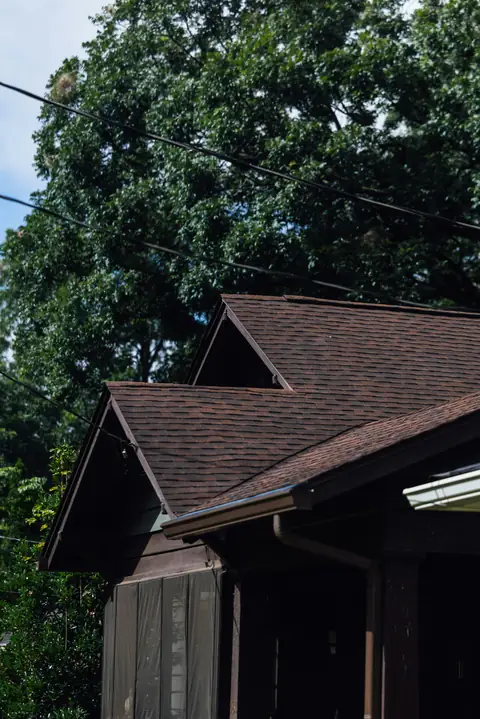 Close view of an asphalt shingle roof and gable